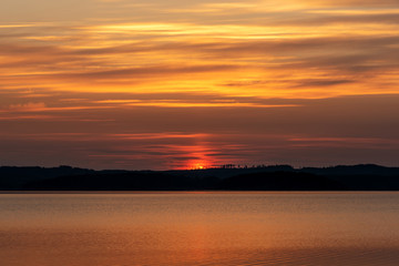 Fototapeta premium Colorful sunrise over lake