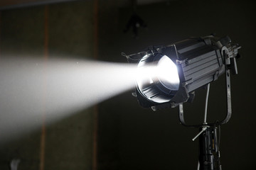 Studio spotlight with a focused beam illuminating haze