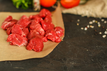 meat raw sliced, cut pieces on a cutting board, fresh. top view. food background