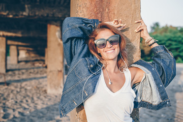 Outdoor fashion portrait of stylish woman on the beach.