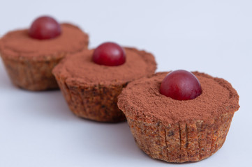 cupcakes with cocoa and grapes