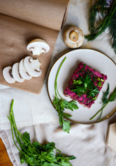 traditional russian beetroot salad "herring under a fur coat" in vegan version with mushroom instead of fish