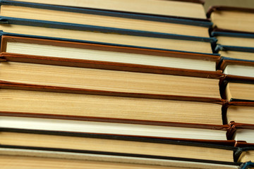 Old paper books with yellowed pages close up