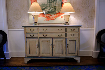 Two Vintage Lamps On A Desk In A Luxury Hallway