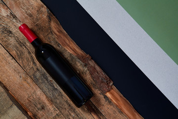 Top view of wine bottle with empty sticker on wooden planks
