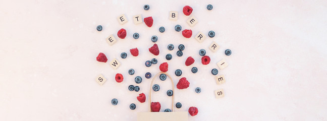 Shopping composition berries flying from bag