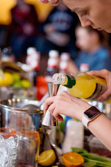 female bartender preparing cocktail in a cocktail bar