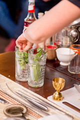 female bartender preparing cocktail in a cocktail bar