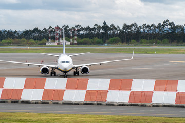Airplane on Airport on cloudy day