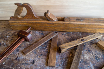 A set of old wooden carpenter tools.