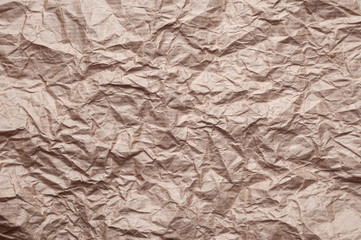Crumpled kraft paper. Texture crumpled recycled old brown paper.