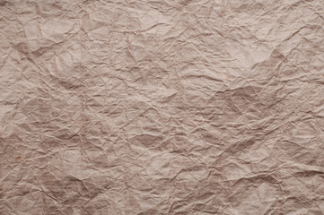 Crumpled kraft paper. Texture crumpled recycled old brown paper.