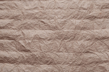 Crumpled kraft paper. Texture crumpled recycled brown paper.
