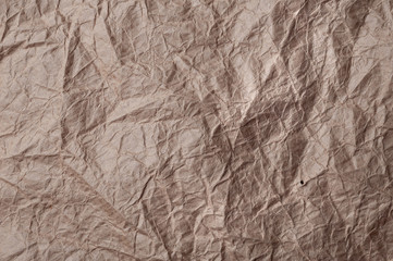 Crumpled kraft paper. Texture crumpled recycled old paper.