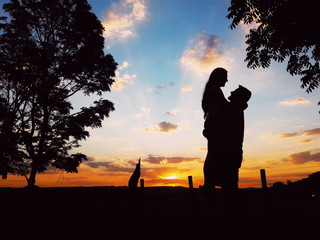 Happy couple with a romantic sunset
