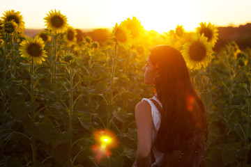 woman in field of sunflowers