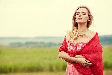 outdoor portrait of a beautiful middle aged blonde woman