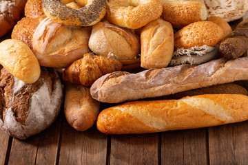 Fresh bread on wooden table
