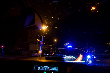 Defocused image of police control. The lights are illuminated blue.