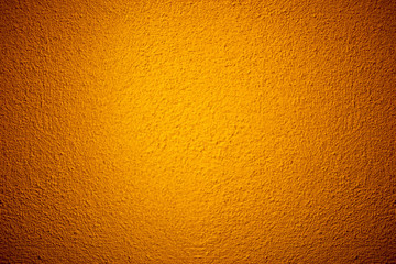 Orange color grunge cement wall texture background