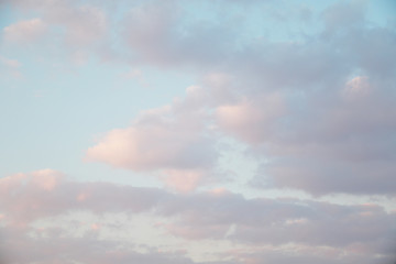 Pink, blue, purple evening sunset sky with cumulus clouds