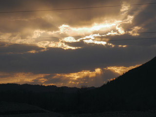 sunset in the mountains by the river Ukraine