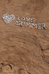 Love summer picture from pebble and sand on a beach