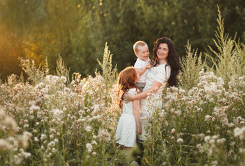 Portrait of happy family having fun outdoor. Concept of happy family, childhood, parenthood