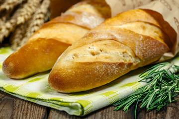 French Bread Baguette.The fresh baked rustic bread loaves in paper bags