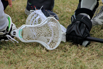 Close up picture ofheads of lacrosse sticks during face-in stage.