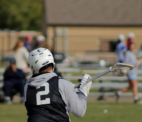 Lacrosse players on the field