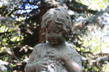 statue of  a girl in a garden