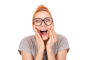 puzzled woman keeping hands on cheeks, looking in great shock