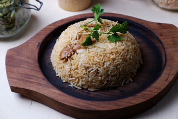 Traditional indian meal with parsley leaf on wooden tray