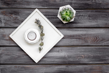 plant, concrete figures and tray decorations for morden home office on wooden background flat lay mockup