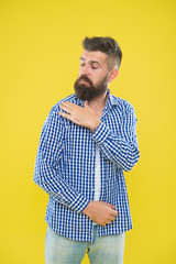 Shake it off. Summer hipster. Brutal bearded hipster in checkered shirt brush dust off shoulder....