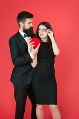 tuxedo man and woman at formal party. valentines day heart. bearded businessman with lady. sexy couple in love. tuxedo formal couple. business meeting. love date. tuxedo bow tie. love is in the air