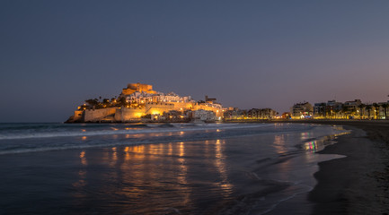 Peniscola skyline and castle beach night illuminated in Castellon of Spain