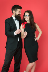 business couple in love on meeting. valentines day heart. bearded businessman with lady on business meeting. formal couple. business meeting. love date. tuxedo man and elegant woman at formal party