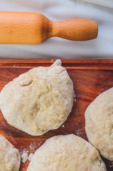 Dough and a rolling pin prepared for kneading 