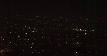 Fireworks ignite over night sky, aerial