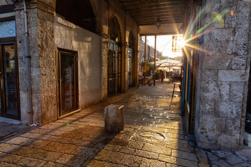 Beautiful view of the ancient streets during a sunny sunrise. Taken in Jaffa Old City, Tel Aviv, Israel.
