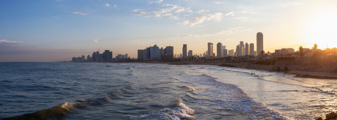 Panoramic view of a modern downtown city on the Mediterranean Sea during a colorful sunrise. Taken in Jaffa, Tel Aviv-Yafo, Israel,