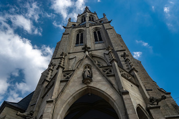 Fototapeta na wymiar Catholic Church against a cloudy sky