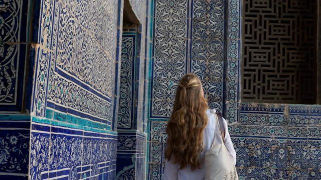 Woman admiring tile in Muslim masque for religion and worship