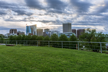 Richmond Virginia skyline during a cloudy sunrise with fast moving clouds