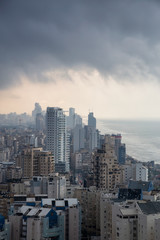 Aerial view of a residential neighborhood in a city during a cloudy sunrise. Taken in Netanya, Center District, Israel.