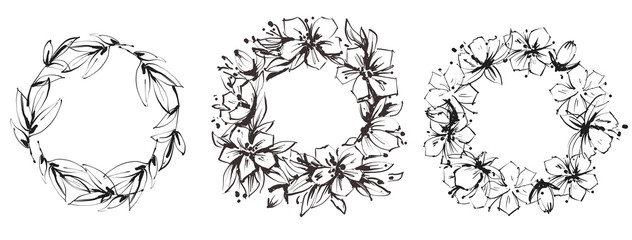 Set of floral circular frames. Graceful wreaths of wild flowers and leaves. Black and white illustration.