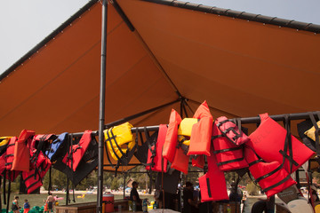 Life jackets to rent at lakeside marina, US, summer, 2017.