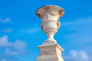 Parisian flower pot against blue sky